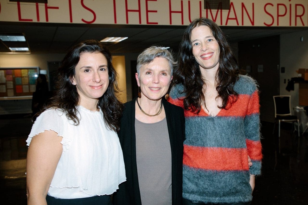 Jodi Kantor standing next to Mary Ellen Stone, standing next to Megan Twohey. They all face the camera and are smiling.